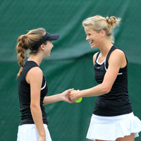 Olivia Thaler (left) and Jeltje Loomans celebrate a point won.
